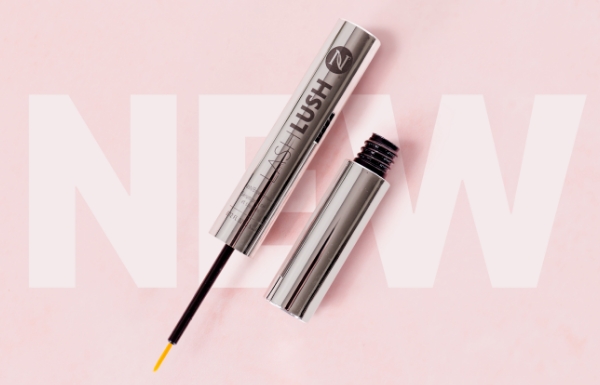 Bottle of Lash Lush 3-in-1 Lash & Brow Serum on a pink background with the word “New”